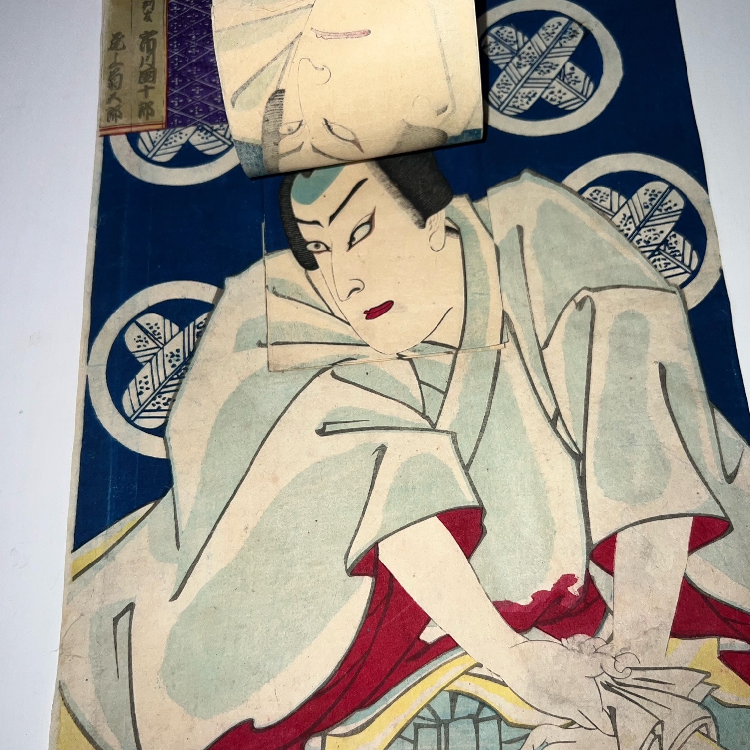 Woodblock printed diptych of kabuki actors with movable faces